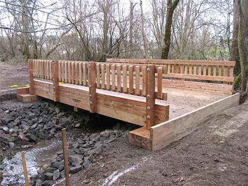 Longitudinal Deck Bridge with Timber Abutments | Vehicular Timber Bridge